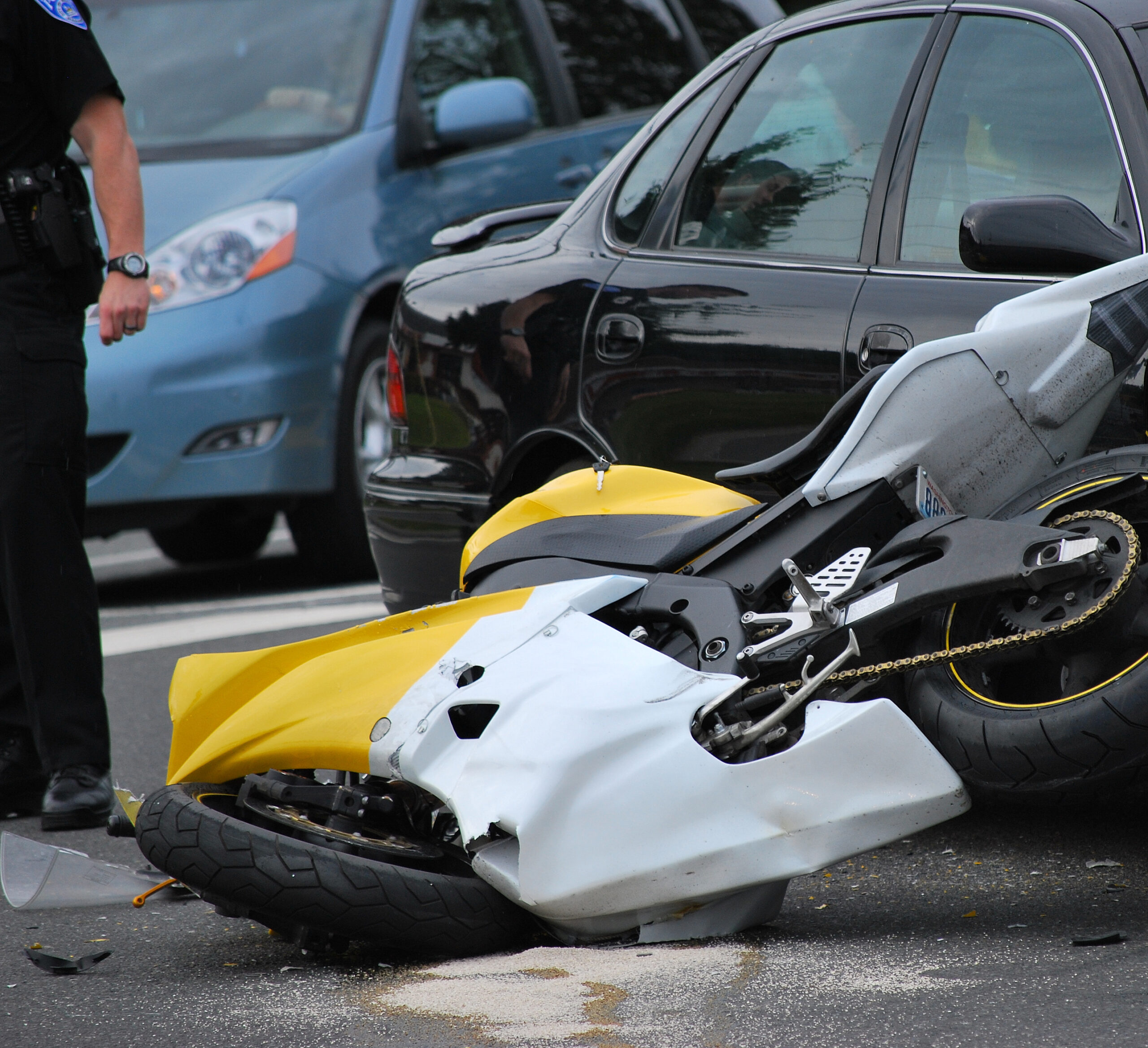 motorcycle accident attorney beverly hills ca helps client in broken yellow black motorcycle after an accident Conlogue Law LLP California