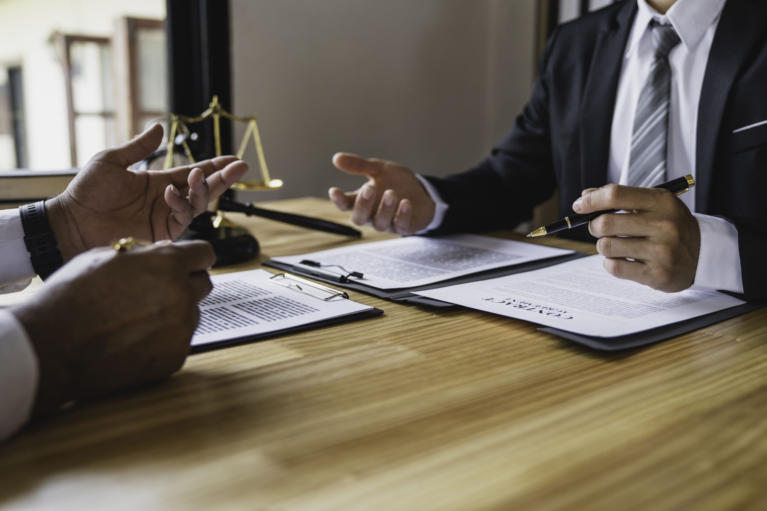 Lawyer working with a client, discussing damages in a motorcycle accident lawsuit