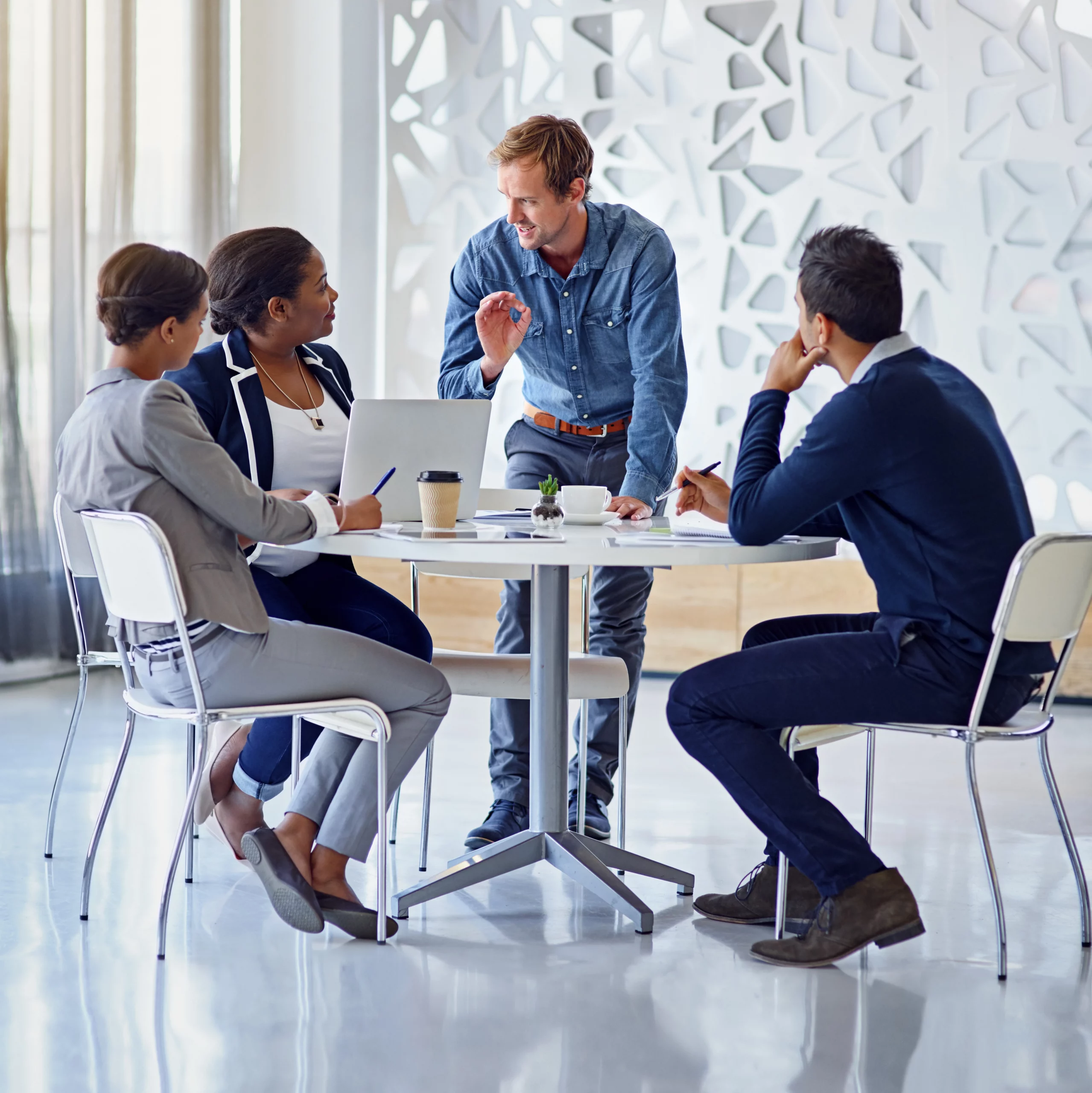 Business team meeting discussing employee rights in a Beverly Hills corporate office.